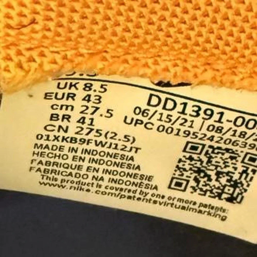 Nike Dunk Low 'Goldenrod' sneakers in yellow/black